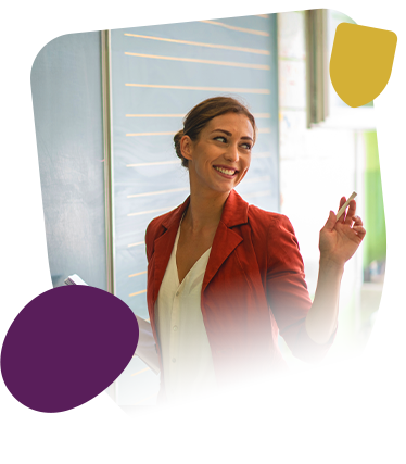 Female teacher in front of chalk board